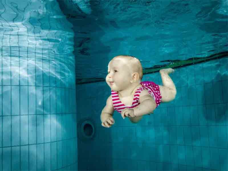 newborn baby swimming